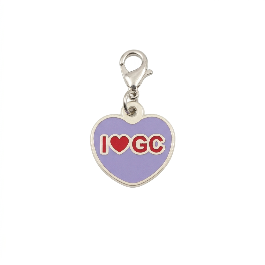 Lavender heart-shaped I Love GC Geocoin with red lettering and silver clasp on white