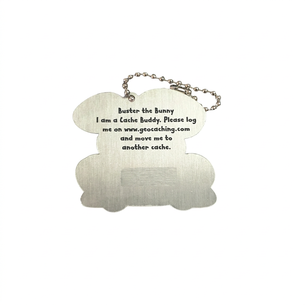 Reverse of Buster the Bunny aluminium trackable tag with logging instructions and unique tracking code hidden
