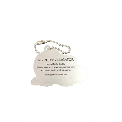 Back of Alvin the Alligator aluminium travel tag with logging instructions and tracking code removed for privacy