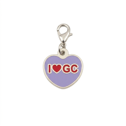 Lavender heart-shaped I Love GC Geocoin with red lettering and silver clasp on white