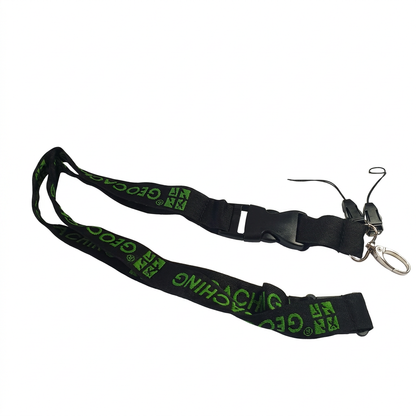 Full black woven lanyard with green Geocaching lettering, quick-release buckle, lobster claw and two accessory connectors