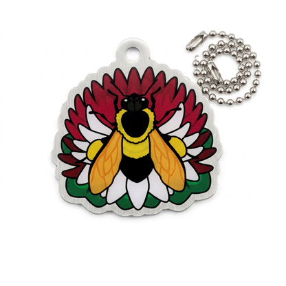 CITO Bee trackable tag with a yellow and black bee, white flower petals and deep red background, with ball chain on white