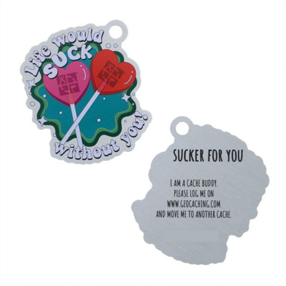 Front and reverse of Sucker For You Trackable Tag, featuring pink and red heart-shaped lollipops and a reverse-side Cache Buddy logging message