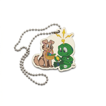 Signal the Frog and Tracker Easter travel tag showing a green frog holding an egg beside a dog with an Easter basket, with silver ball chain
