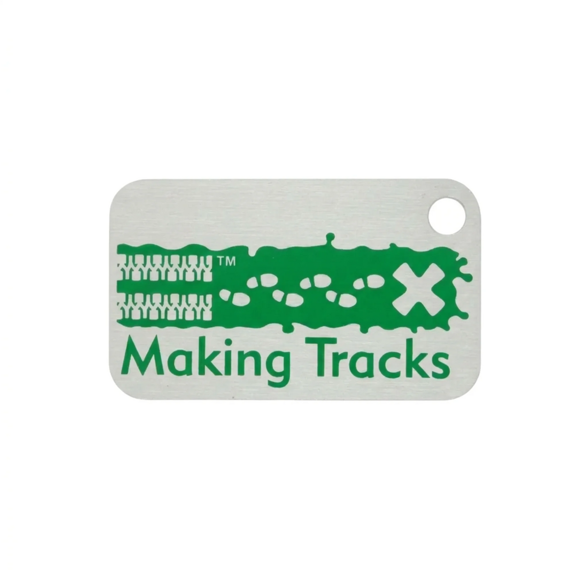 Green Making Tracks metal trackable tag with tyre tracks, footprints and X design on a white background