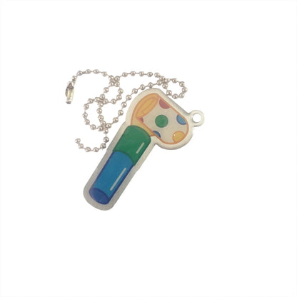 Party Blower Trackable with blue and green body, colourful spotted rolled end and silver ball chain