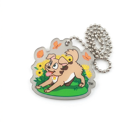 Spring Tracker travel tag with an open attachment hole and silver ball chain, featuring a playful dog, flowers and butterflies on white